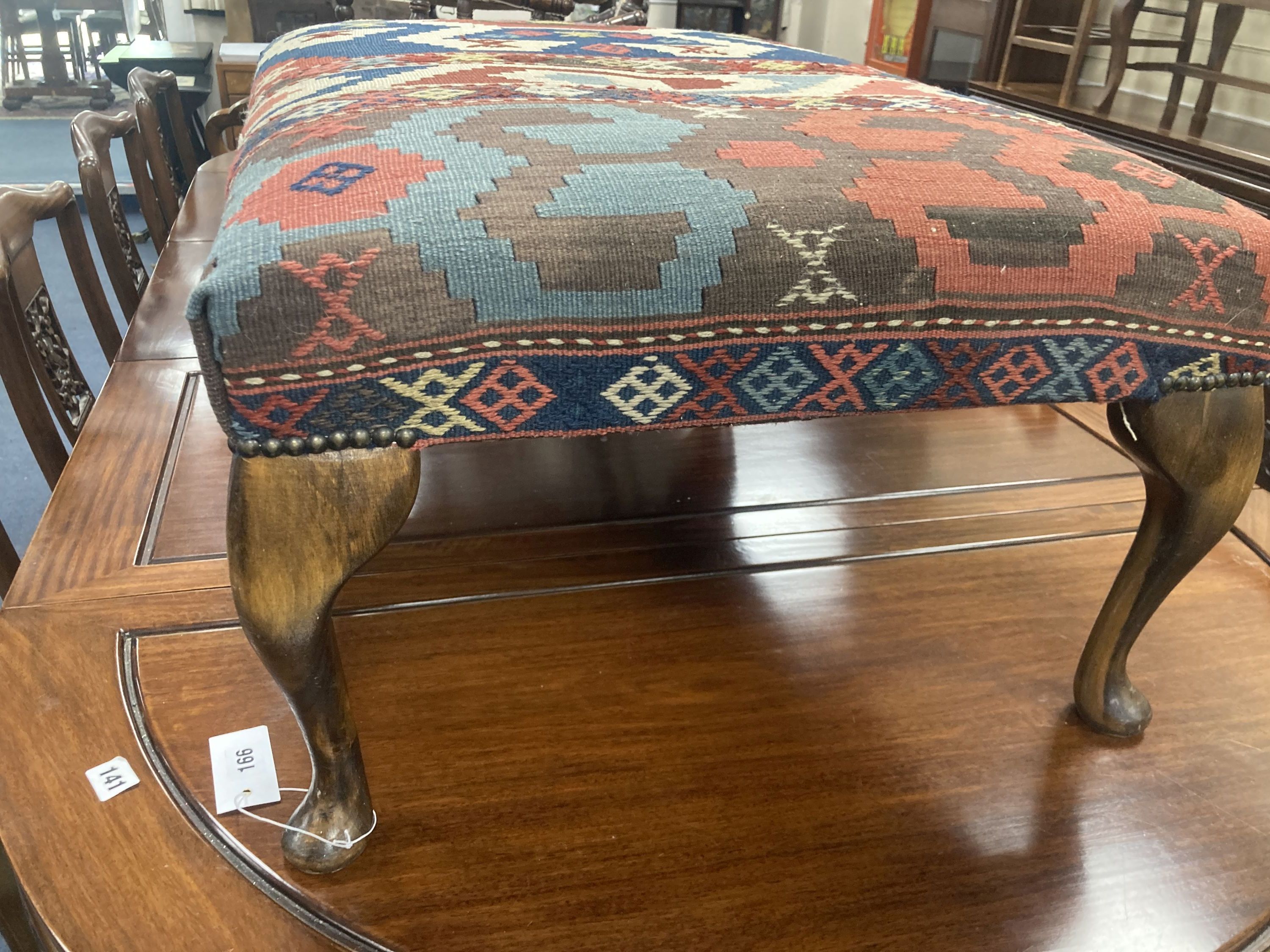 A large rectangular Kelim covered footstool, length 81cm, depth 55cm, height 36cm